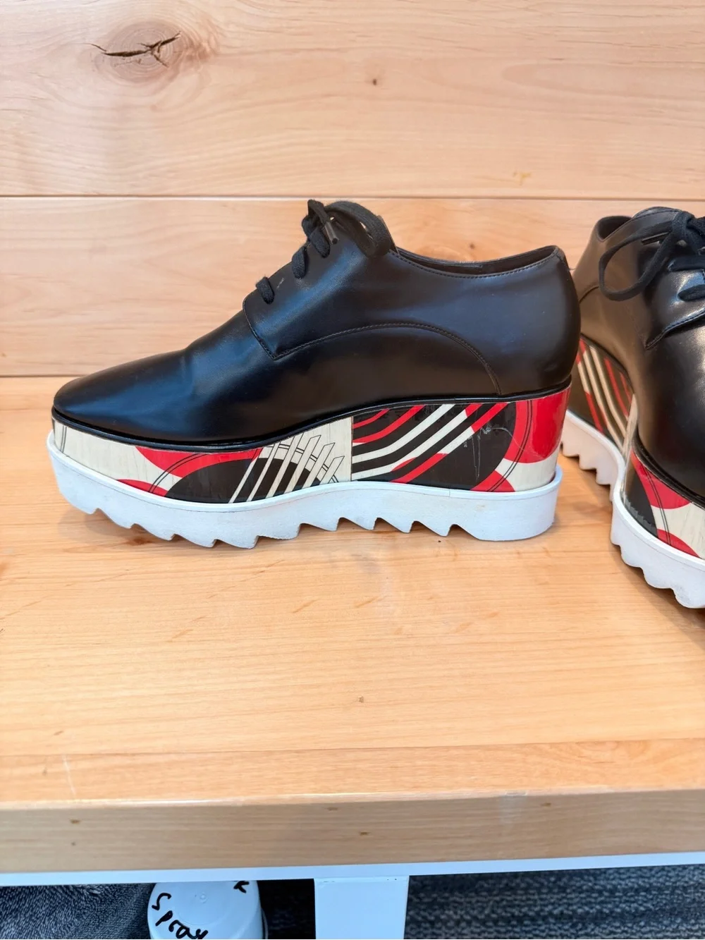 Stella McCartney Black Leather Elyse Platform Shoes with abstract design.